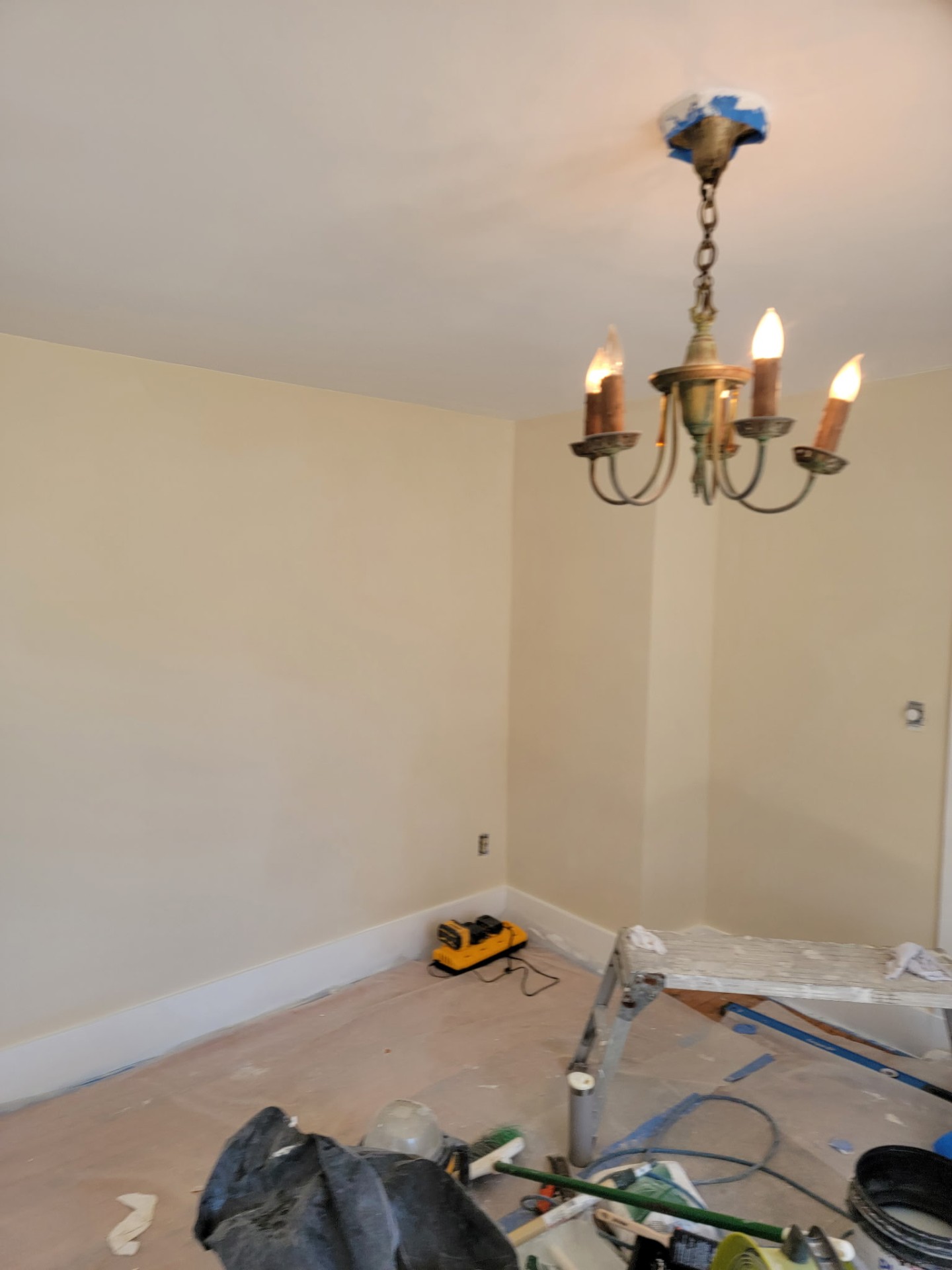 After — Damaged interior wall → patched & repainted
